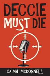 The book cover for Deccis Must Die by Caimh McDonnell (near as I can get it Caimh is pronounced KEE-va or KWEE-va).

The image has a red background with a large old fashioned style stand microphone surrounded by a white gun sight styled target. The title of the book in centre at the top in a large, uneven font. 