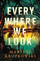 The book cover for Every Where We Look by Martine Kropkowski is a view of still water through a tree. There&#039;s a young figure standing in the water at the bottom, where the water is reflecting a green sky above. There&#039;s a yellow glow in the distance, past a row of trees that is reflected in the rest of the water body.