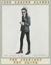 The cover for John Cooper Clarke&#039;s The Luckiest Guy Alive, which is mostly in grey colours, with the author&#039;s name at the top and the book title at the bottom in a form that looks like Scrabble tiles. In the centre is the image of the author, wearing black as usual, sunglasses as usual, and he&#039;s standing legs apart slightly off centre from the viewer with one arm held up in front of his body. His hair is gloriously messy. 