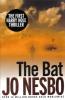 The book cover for The Bat by Jo Nesbo includes a black &quot;sticker&quot; circle with the note - The First Harry Hole Thriller in it. The image is of a man with his back to the viewer, walking through dry red dust with a blue cloudy sky above, birds flying above, and a building off in the distance. The tagline &#039;Over 14 Million Books Sold Worldwide&#039; is at the bottom