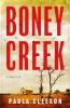 Book cover for Boney Creek by Paula Gleeson with the tagline &quot;A Thriller&quot;.

The image shows a typical rural weatherboard small church in the distance, on dry red dirt, with a couple of dead saplings at the forefront and a small what looks like stone building off to the right. There&#039;s a really big sky above it, which is slightly hazy brownish yellow, with lots of black birds circling overhead.