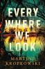 The book cover for Every Where We Look by Martine Kropkowski is a view of still water through a tree. There&#039;s a young figure standing in the water at the bottom, where the water is reflecting a green sky above. There&#039;s a yellow glow in the distance, past a row of trees that is reflected in the rest of the water body.