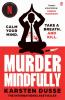 The book cover for Murder Mindfully by Karsten Dusse includes a few taglines &#039;Calm Your Mind&#039; to the left and &#039;Take a Breath. And Kill.&#039; to the right of a figure in a black business suit and tie, white shirt with red splatters across it. He&#039;s sitting in a yoga position, legs crossed, hands joined palm to palm above his head. There&#039;s a large knife to the right of him. There&#039;s a &quot;sticker&quot; at the top with the Netflix logo in it and the words &#039;A Netflix Series&#039;.

At the bottom, under the title and author&#039;s name, the words &#039;The International Bestseller&#039; appear. The cover is white on the top half, red at the bottom.